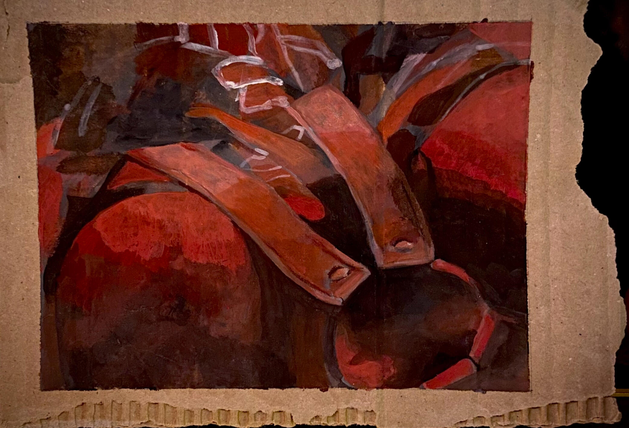 abstracted image of harness straps and ring, seen very close up, all in shades of red.